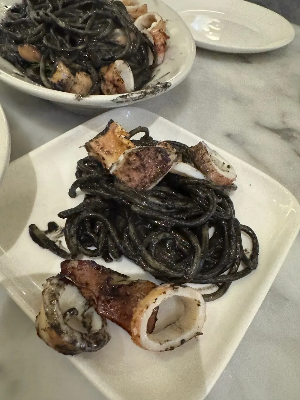 A single bite of squid ink pasta