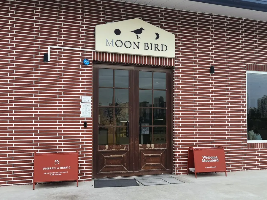 View of Moonbird's café with the lawn garden visible