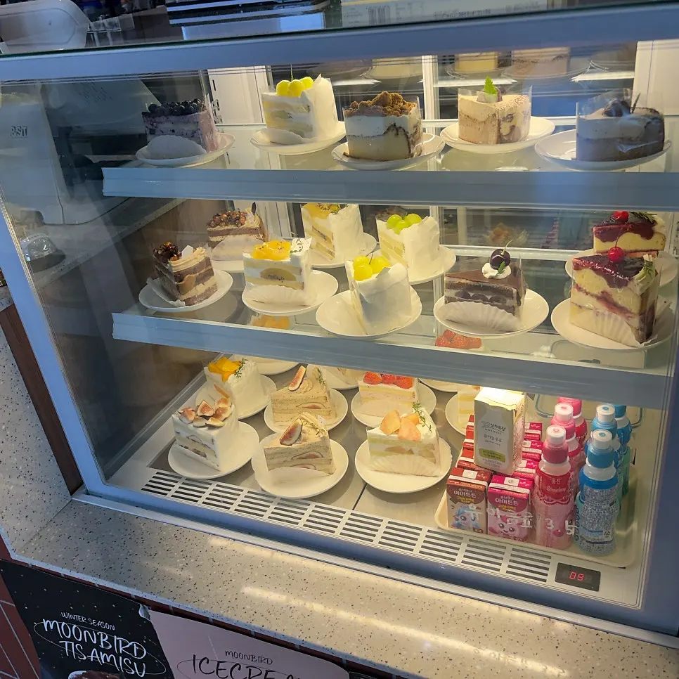 Overview of bread and cake display at Moonbird