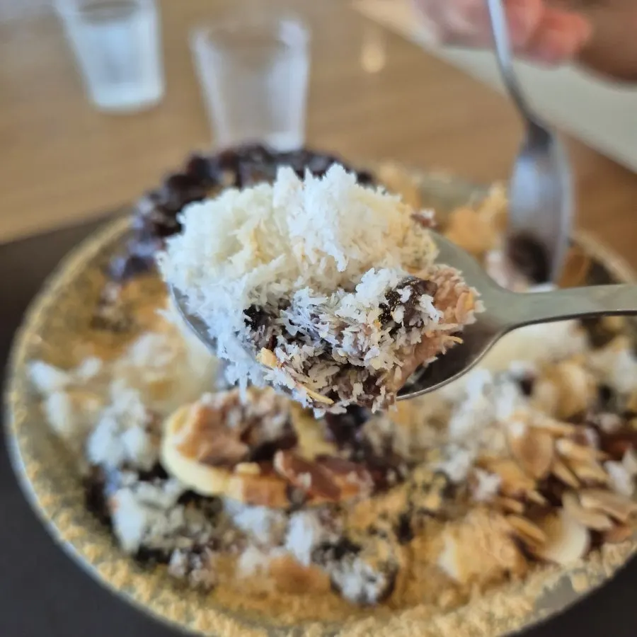 Snow ice ringed with soybean powder, almonds, and injeolmi rice cake