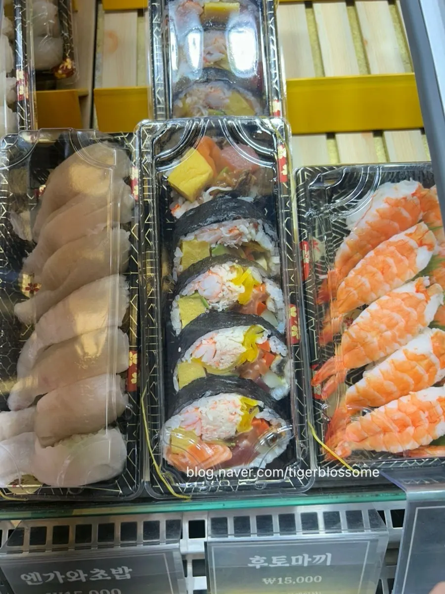 Futomaki and an assortment of fish on display
