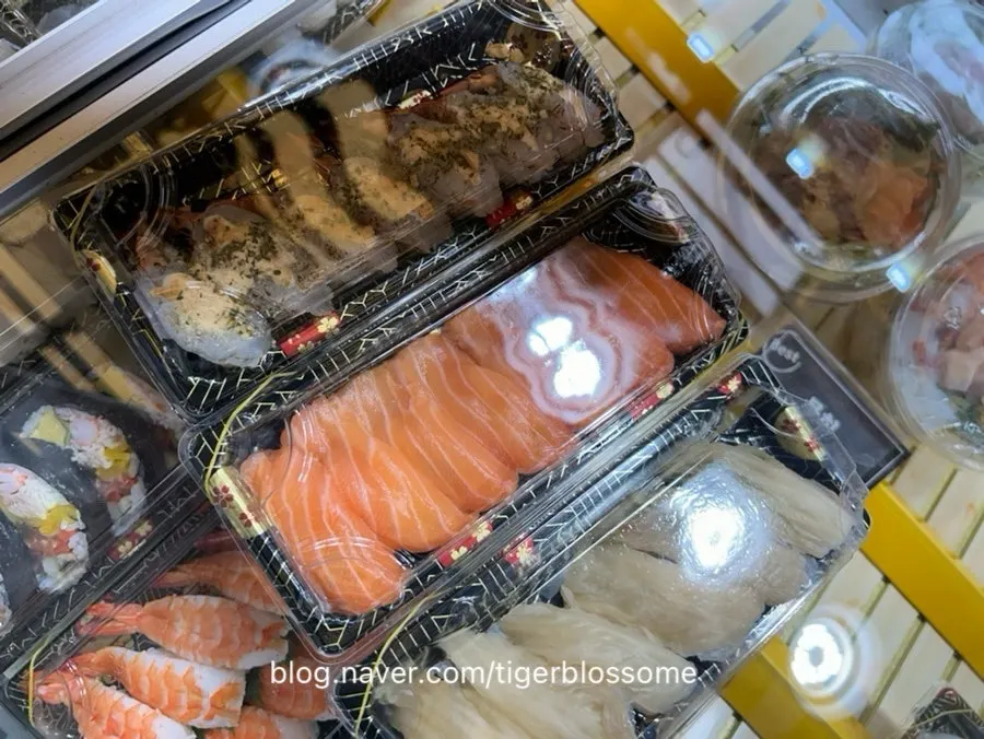 Order of garlic shrimp, salmon, and aged-kimchi halibut sushi
