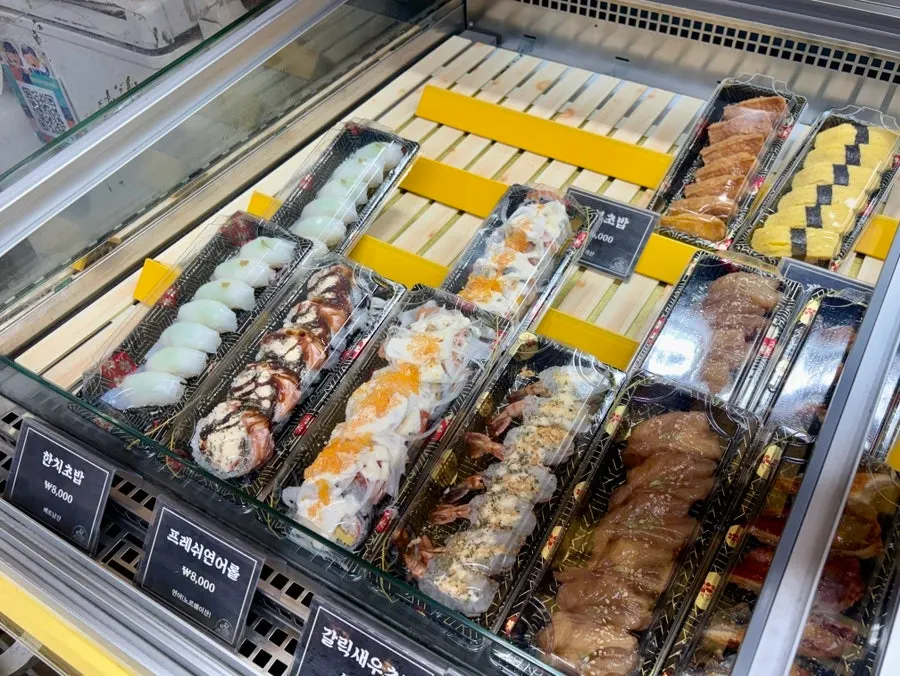 Sushi boxes lined up in the showcase