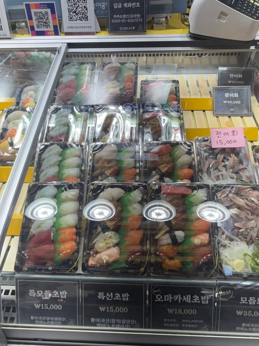 Salmon, shrimp and other sushi on display