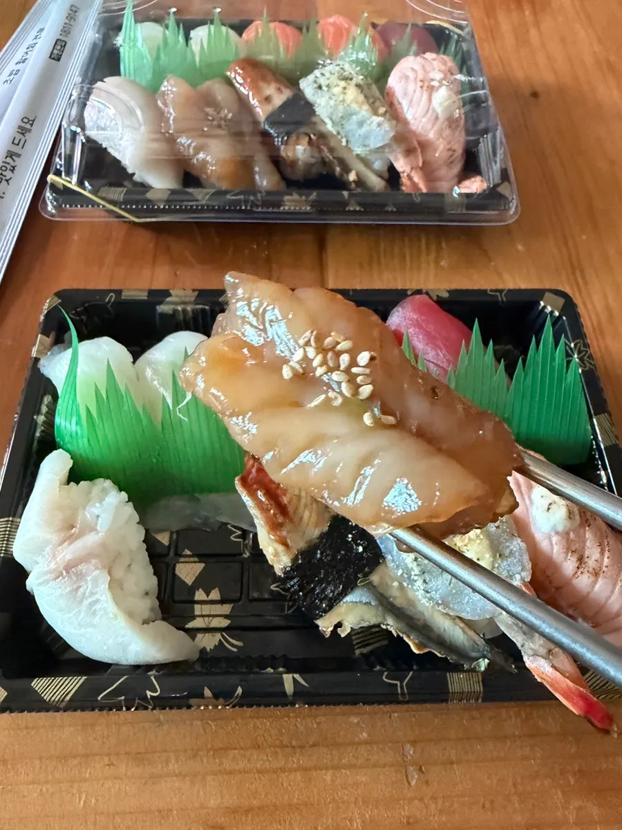 Sushi served with soy sauce, pickled ginger and miso soup
