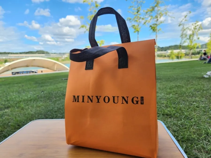Sushi takeout shopping bag carried around Moraenae Market