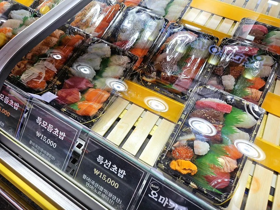 Display of popular items including omakase sushi and special sushi