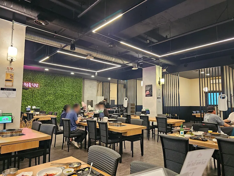 Hall seating with generous spacing between tables