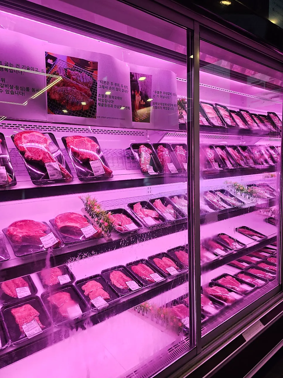 Refrigerated display case with cuts of meat