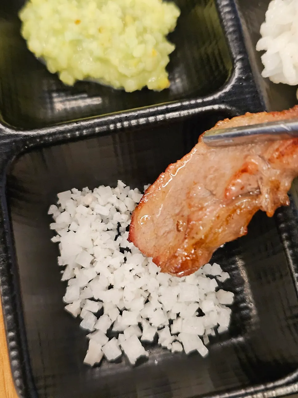 A piece of cut meat served ready to eat