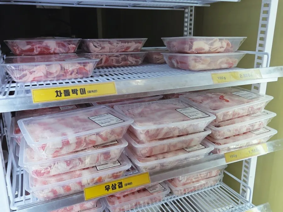 Neatly stacked packs of brisket and beef short rib slices