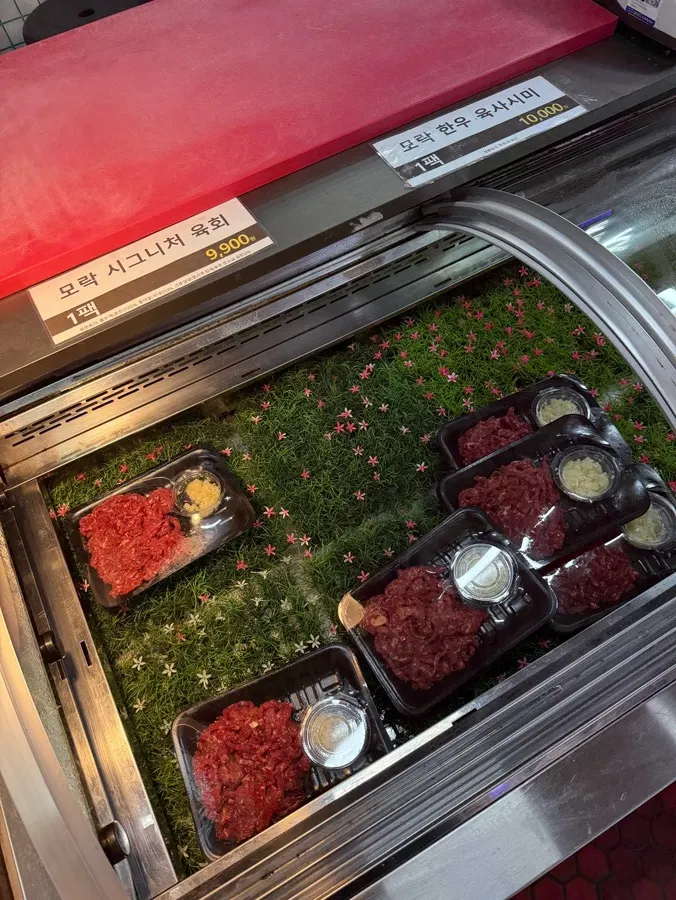 Showcase displaying yukhoe and yuksashimi