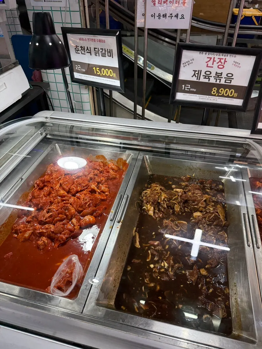 Display case of marinated meats including Chuncheon-style dakgalbi