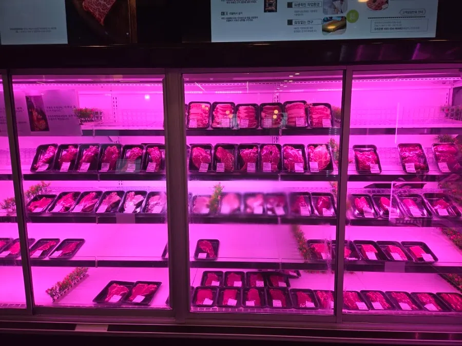 Refrigerated meat display case where guests pick their own cuts