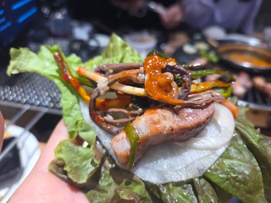 Pork belly wrapped in lettuce and radish wraps