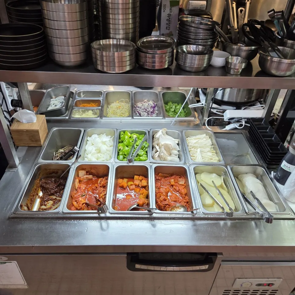 Self-serve bar with side dishes and cutlery