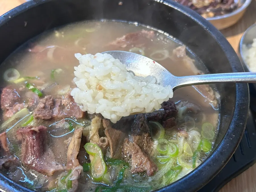 A meal of galbitang with rice mixed into the broth
