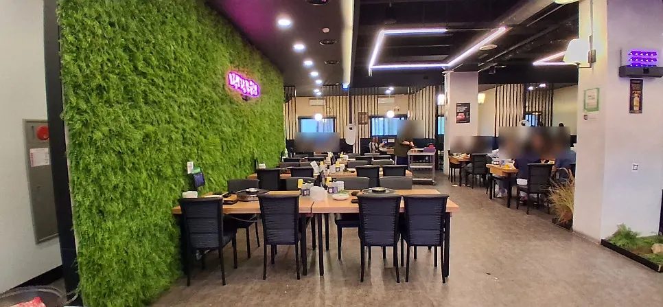 Interior with a green wall and neon signs
