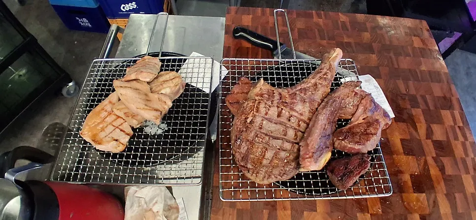 Pre-grilling scene at the charcoal grill station