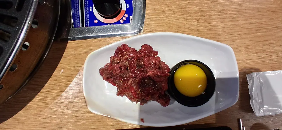 Beef tartare mixed with egg yolk