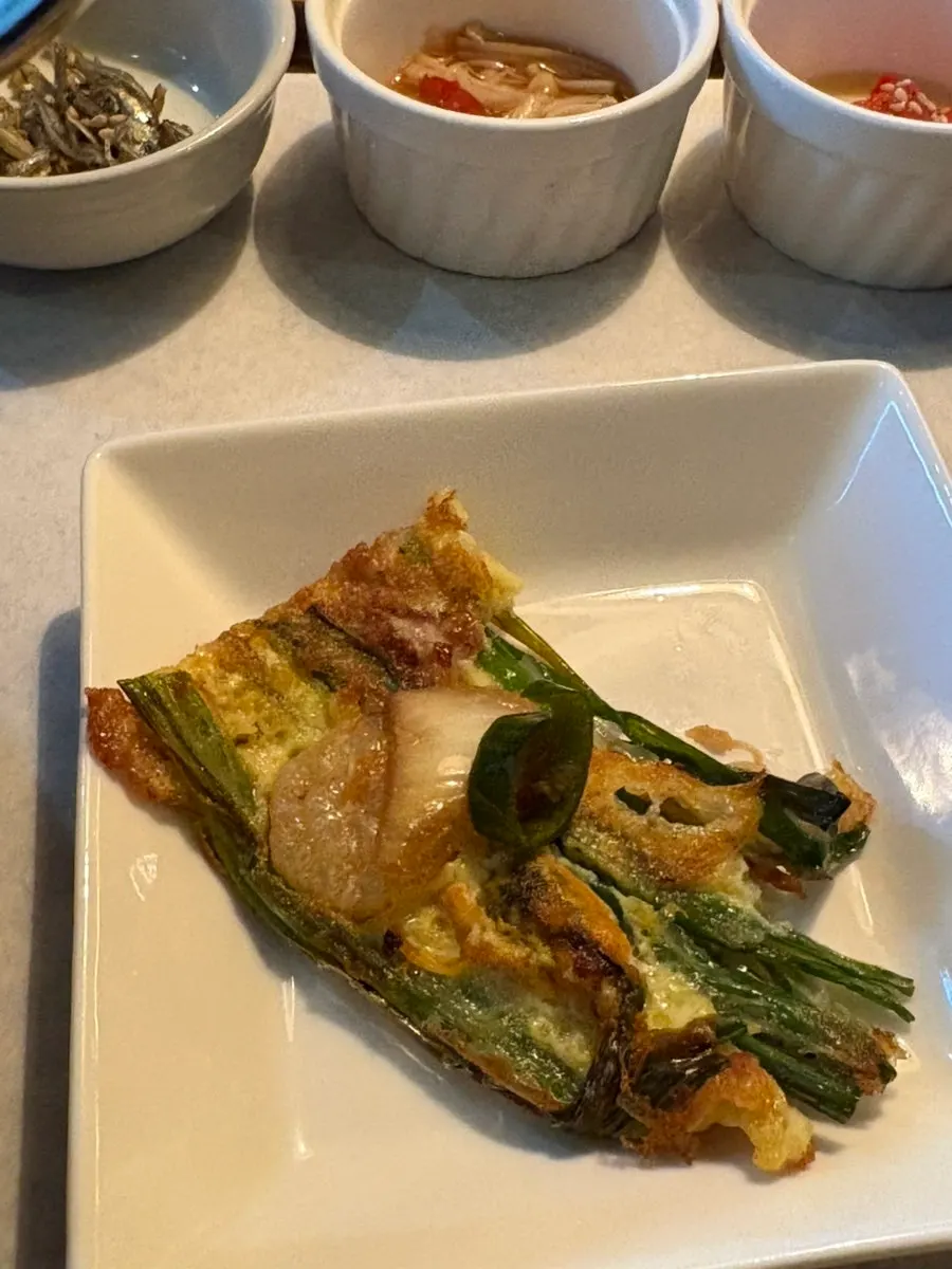 Full table spread including the seafood pancake