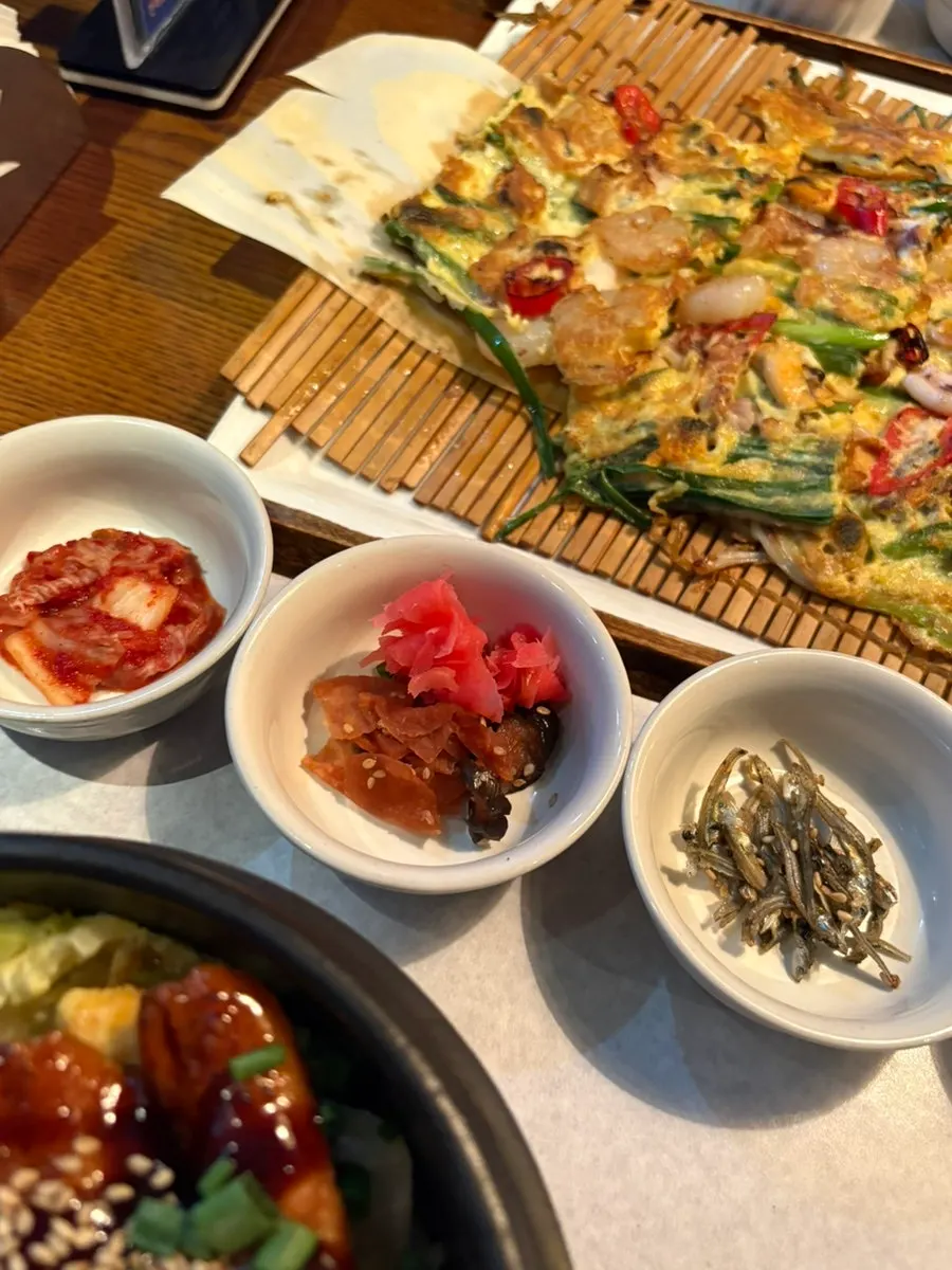 Close-up of squid, shrimp, and mussels inside the pancake