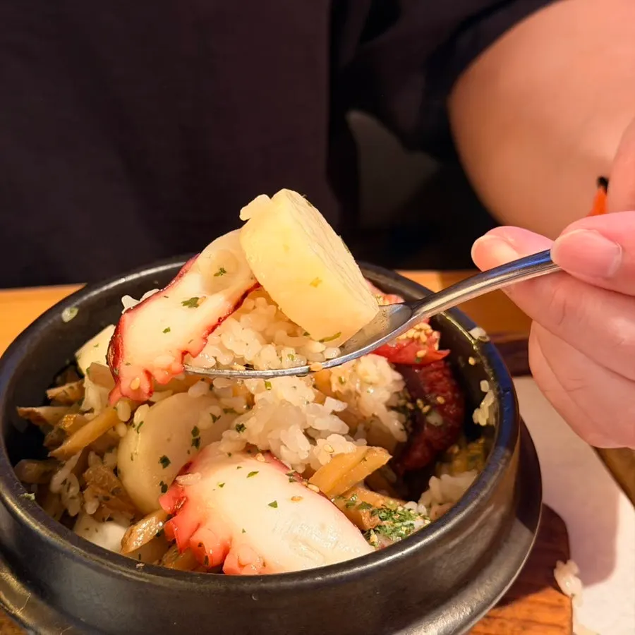 Seafood sotbap topped with a large scallop
