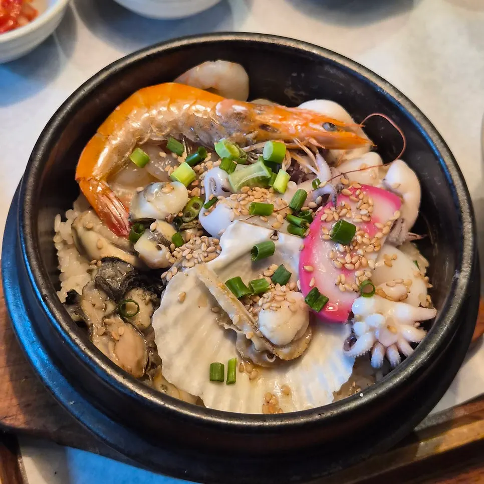 Seafood sotbap topped generously with seafood