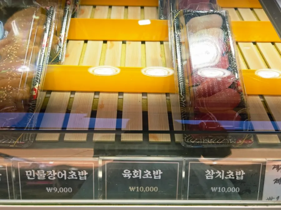 Packaged sushi containers on display