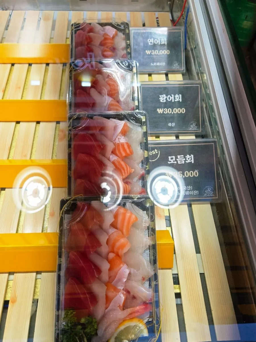 Vertical shot of the sushi display case