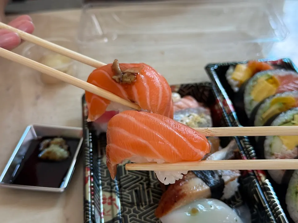 Salmon sushi with a thick slice on top