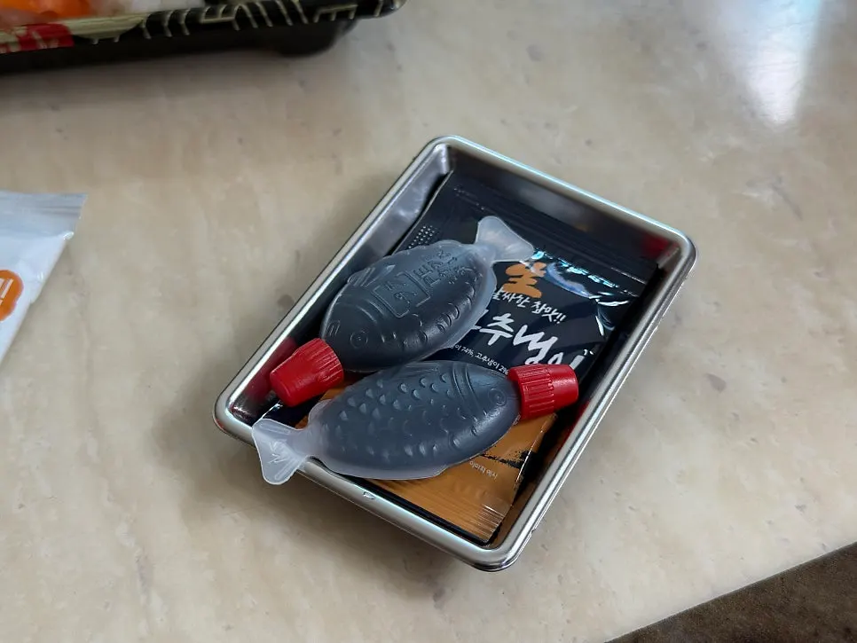 Soy sauce dish and wasabi provided with the order