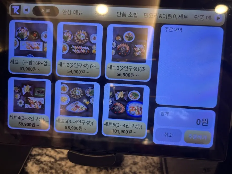Photo menu board placed in front of the restaurant