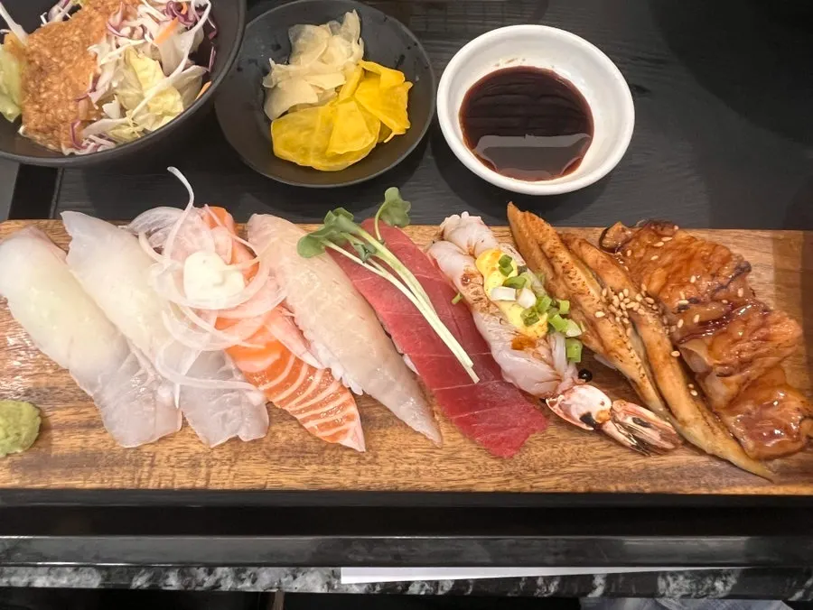 Sushi and side dishes served together with the sashimi platter