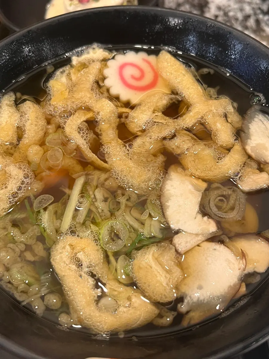 Salmon sashimi picked up with chopsticks
