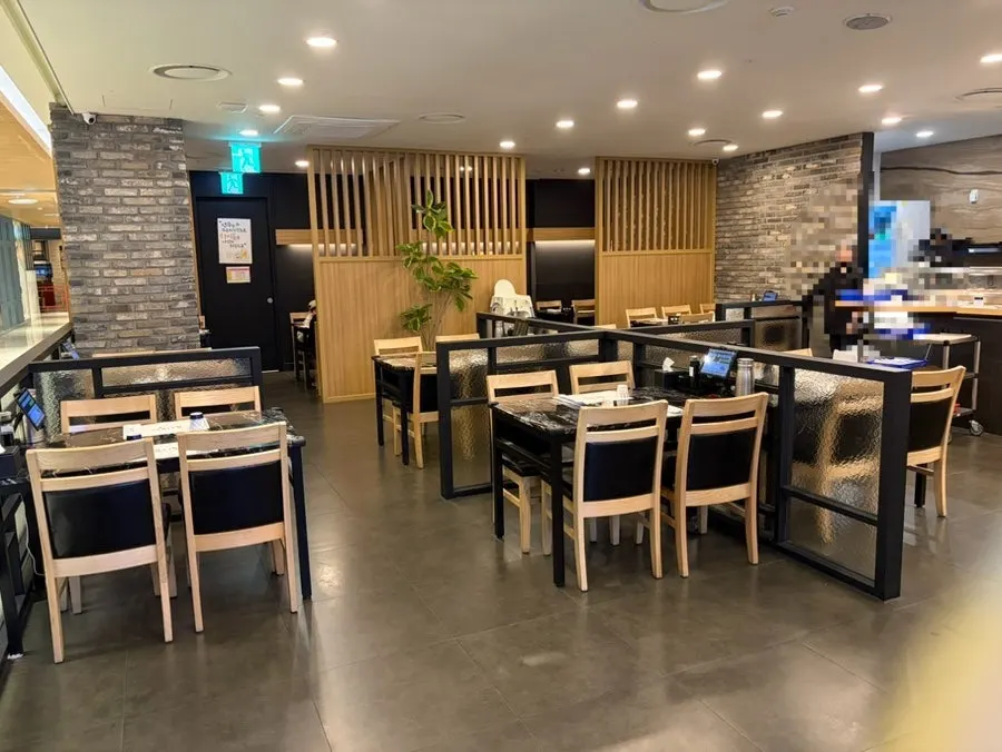 Interior of Moshi Moshi Sushi Dongnae Branch on a weekend evening