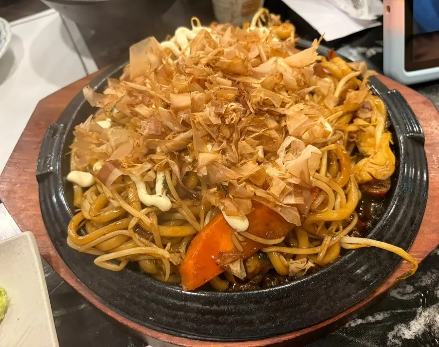 Seafood yaki udon topped with bonito flakes