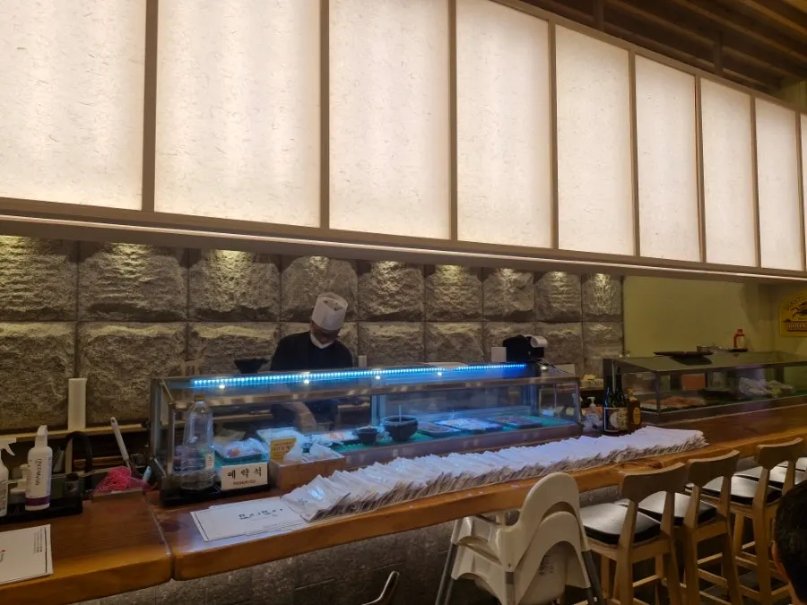 A table at Moshi Moshi Sushi Gwangbok with a baby chair
