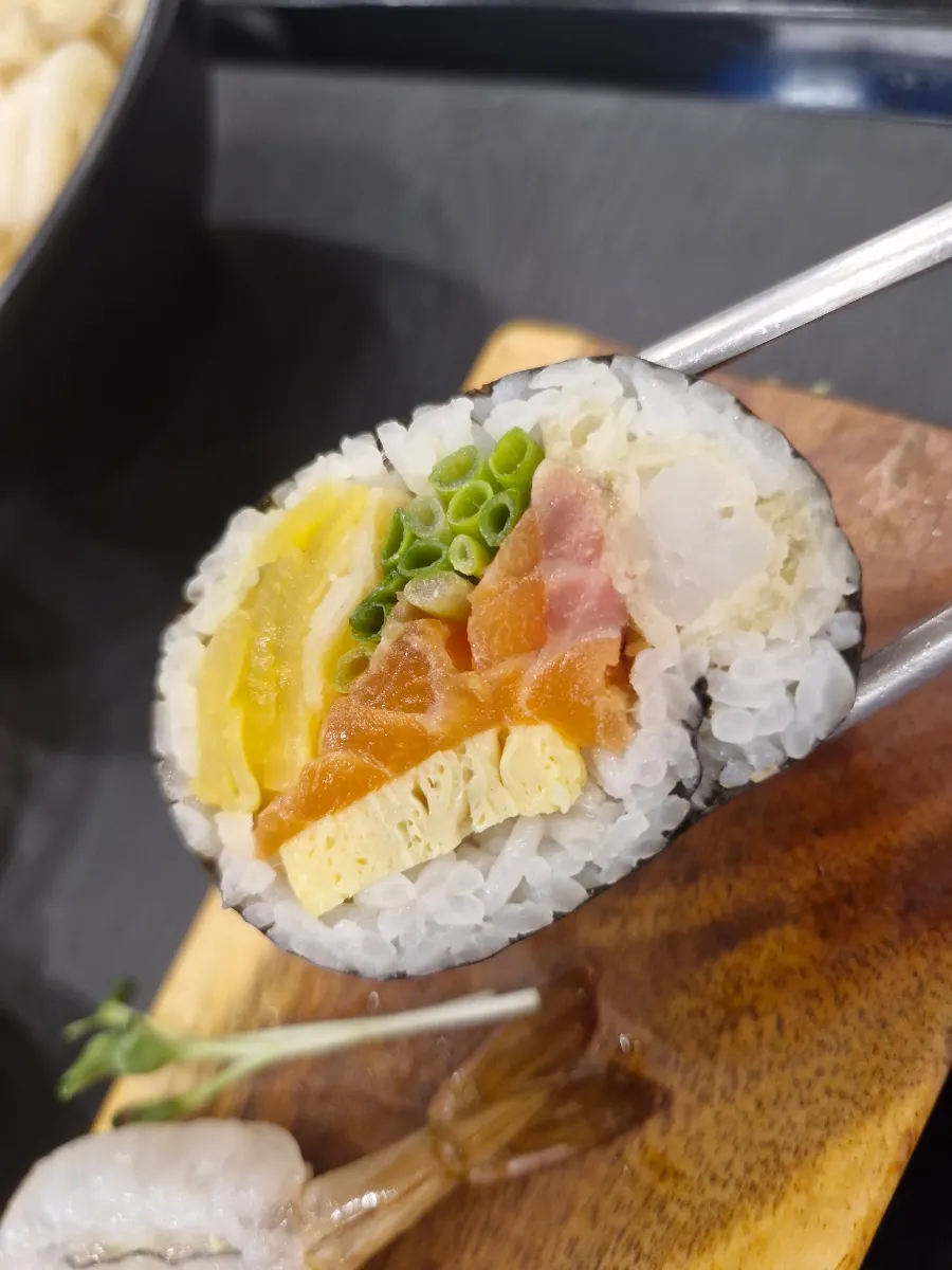 Futomaki roll filled with fish and egg