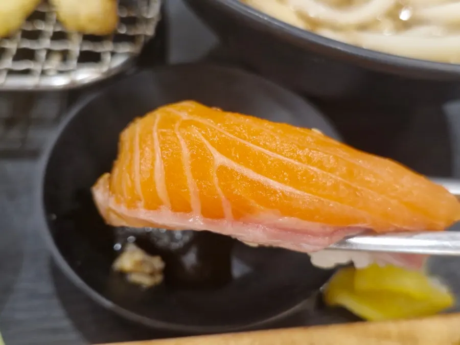 Sushi dipped in wasabi soy sauce
