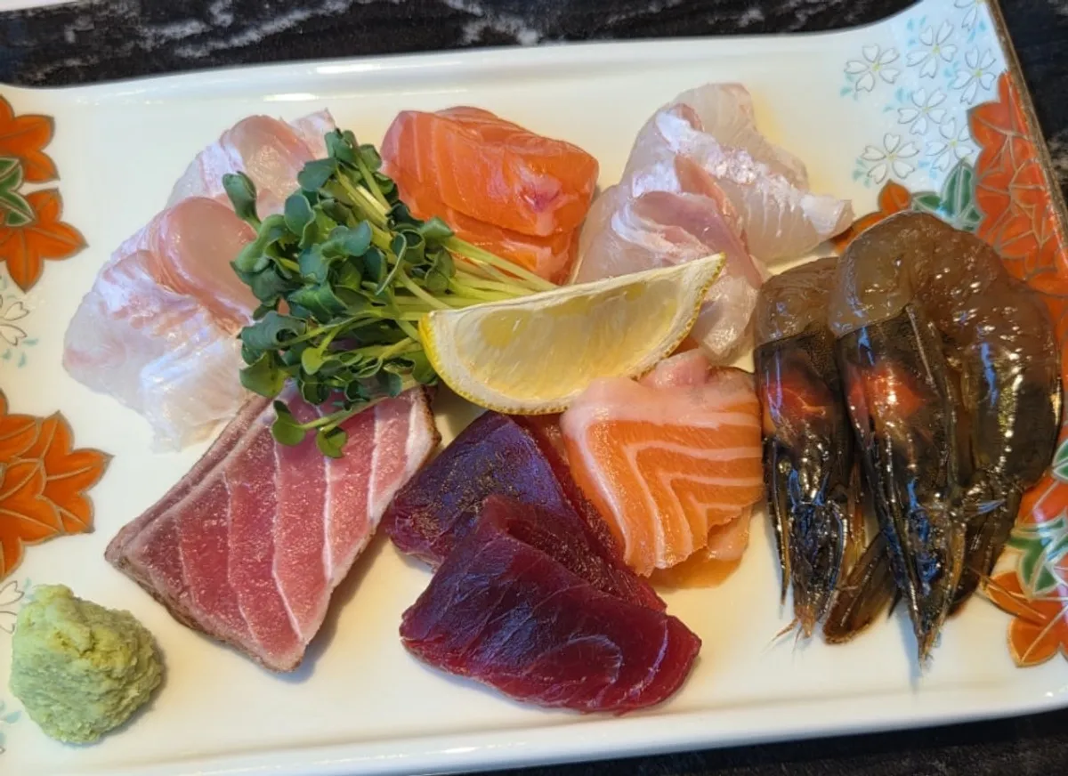 Plate of flounder, salmon and tuna sashimi served as the first B-course dish