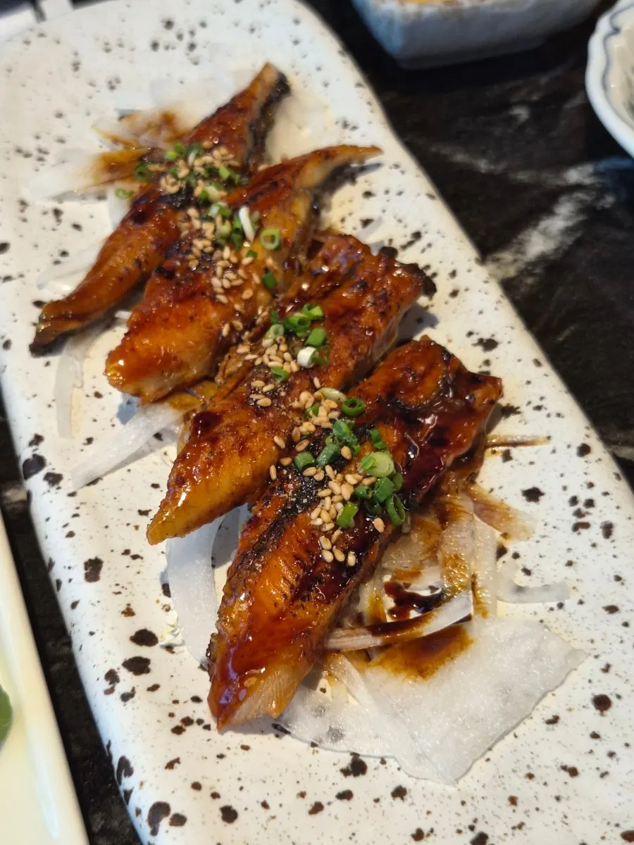 Plate of Korean beef yukhoe, octopus wasabi, and seasoned grilled eel