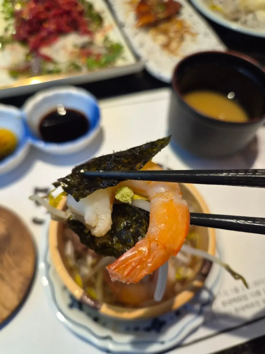 Steamed dish with squid, beef and shrimp