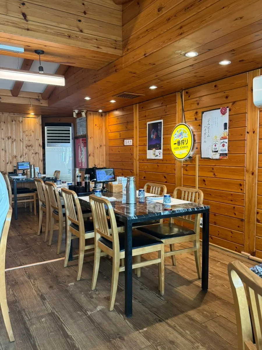 Interior with widely spaced tables at Moshi Moshi PNU Branch
