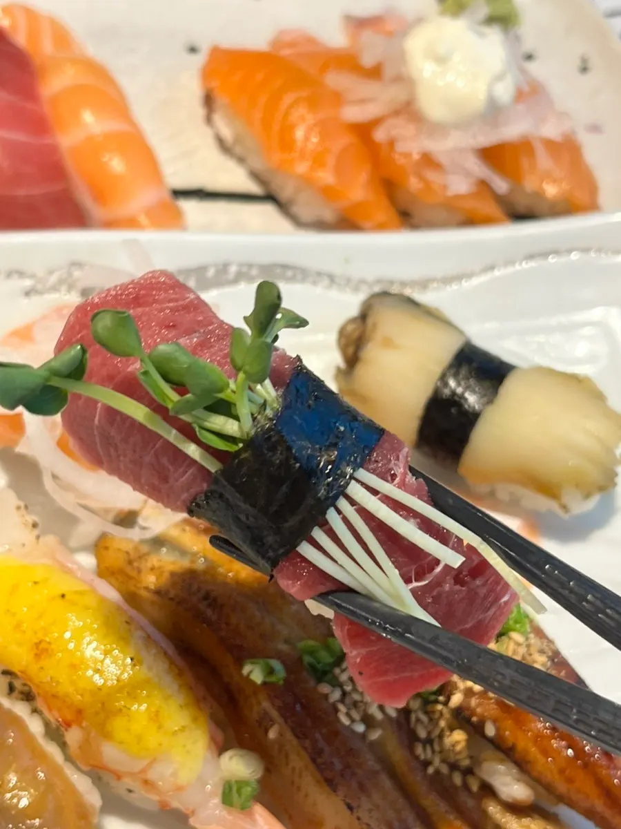 Omakase sushi 12 pieces topped with white fish and abalone