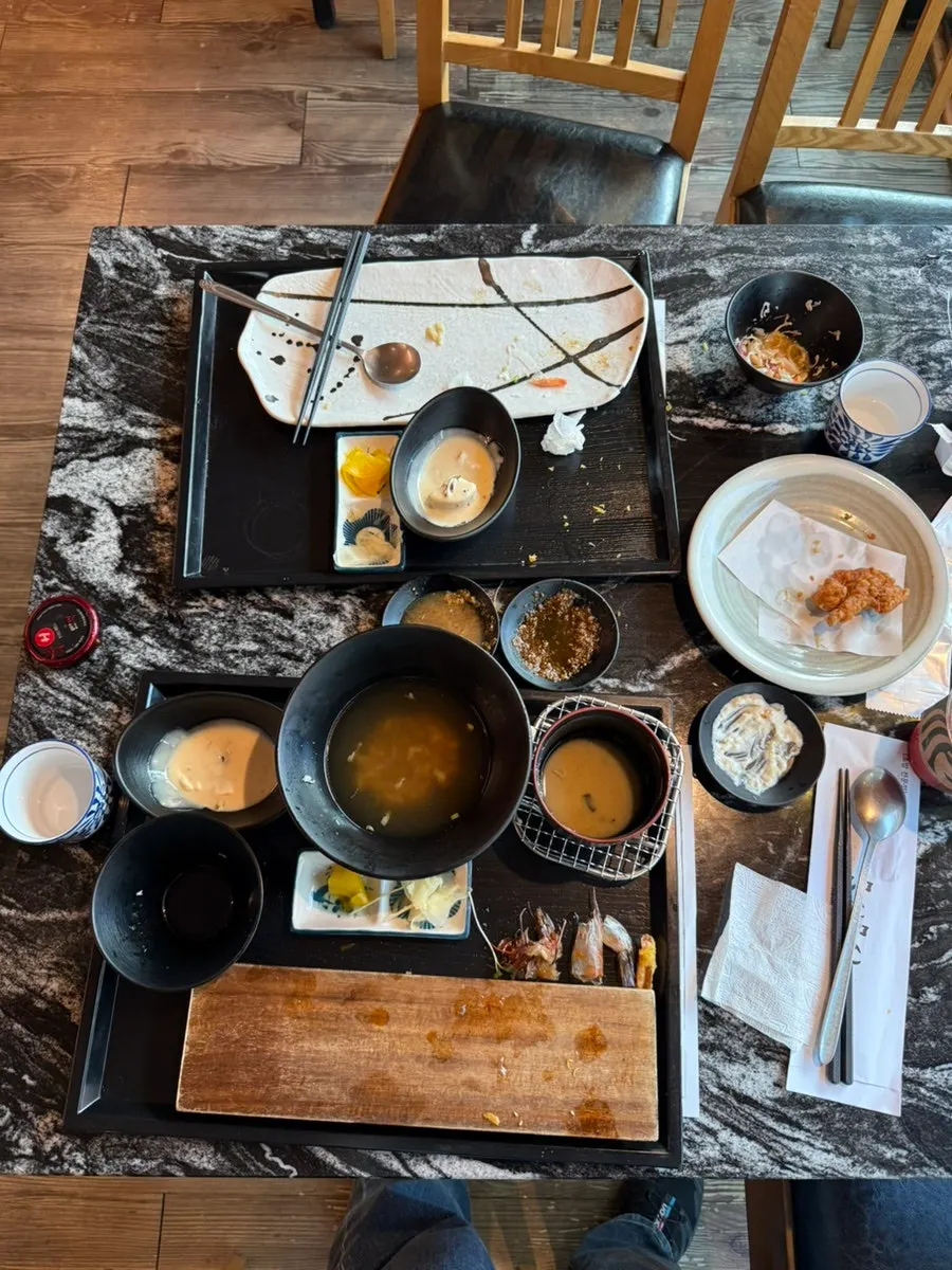 Lunch spread with sushi and side dishes together