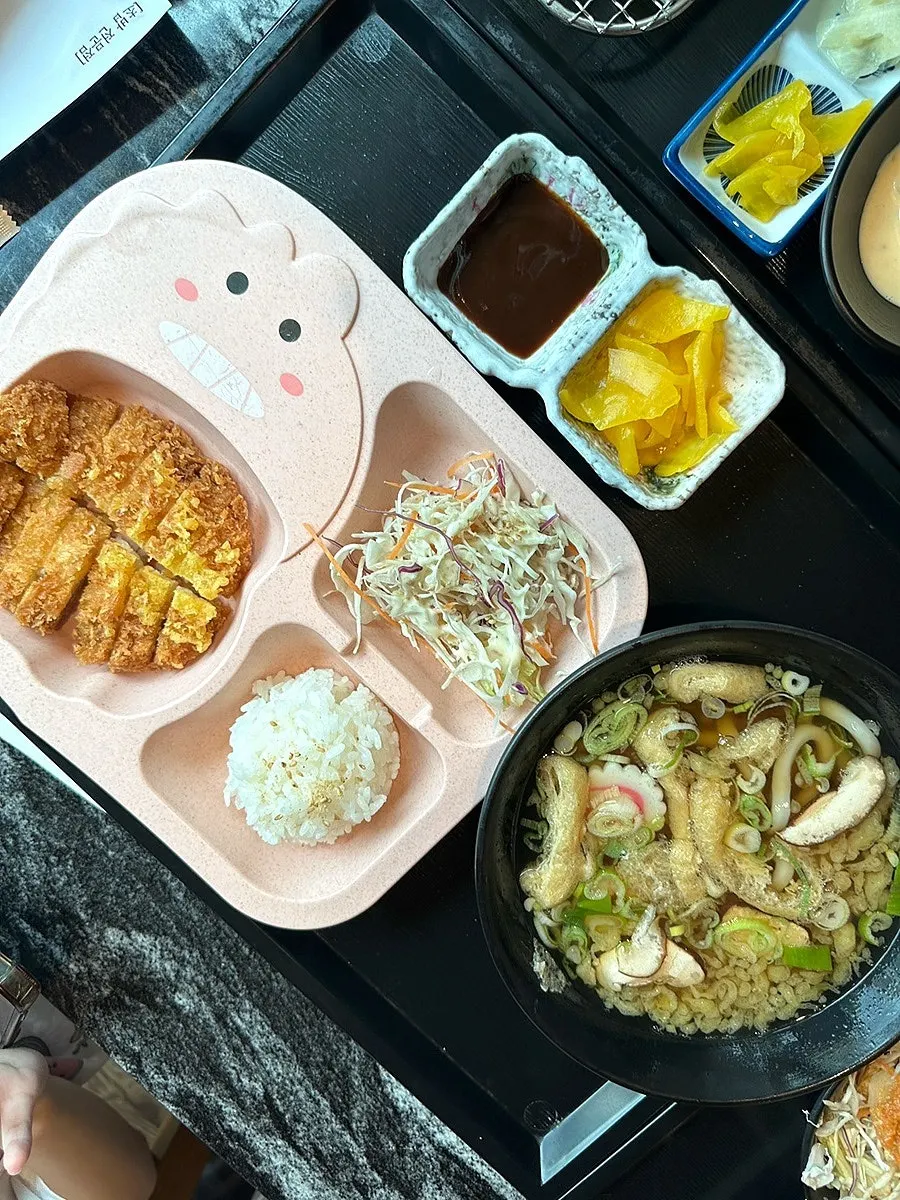 Udon broth and sushi set on the table