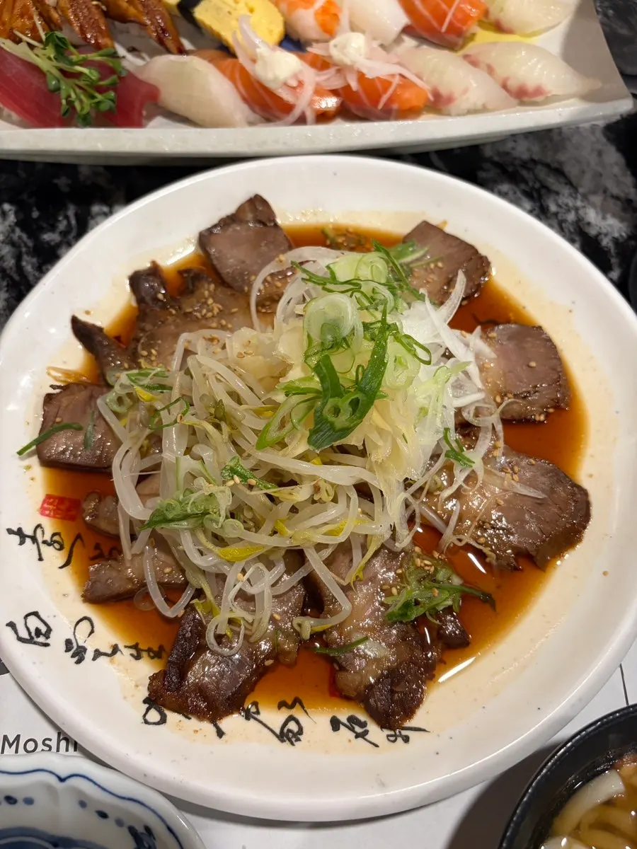 Warm chashu served with bean sprouts
