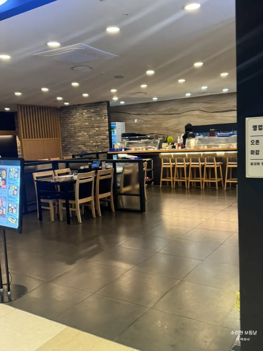 Interior view showing the bar seats facing the kitchen