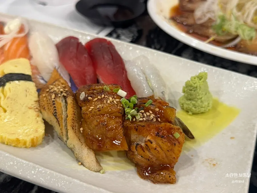 Close-up of flounder and salmon sushi on the platter